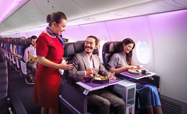 Virgin Australia guests enjoying meals served in business class cabin