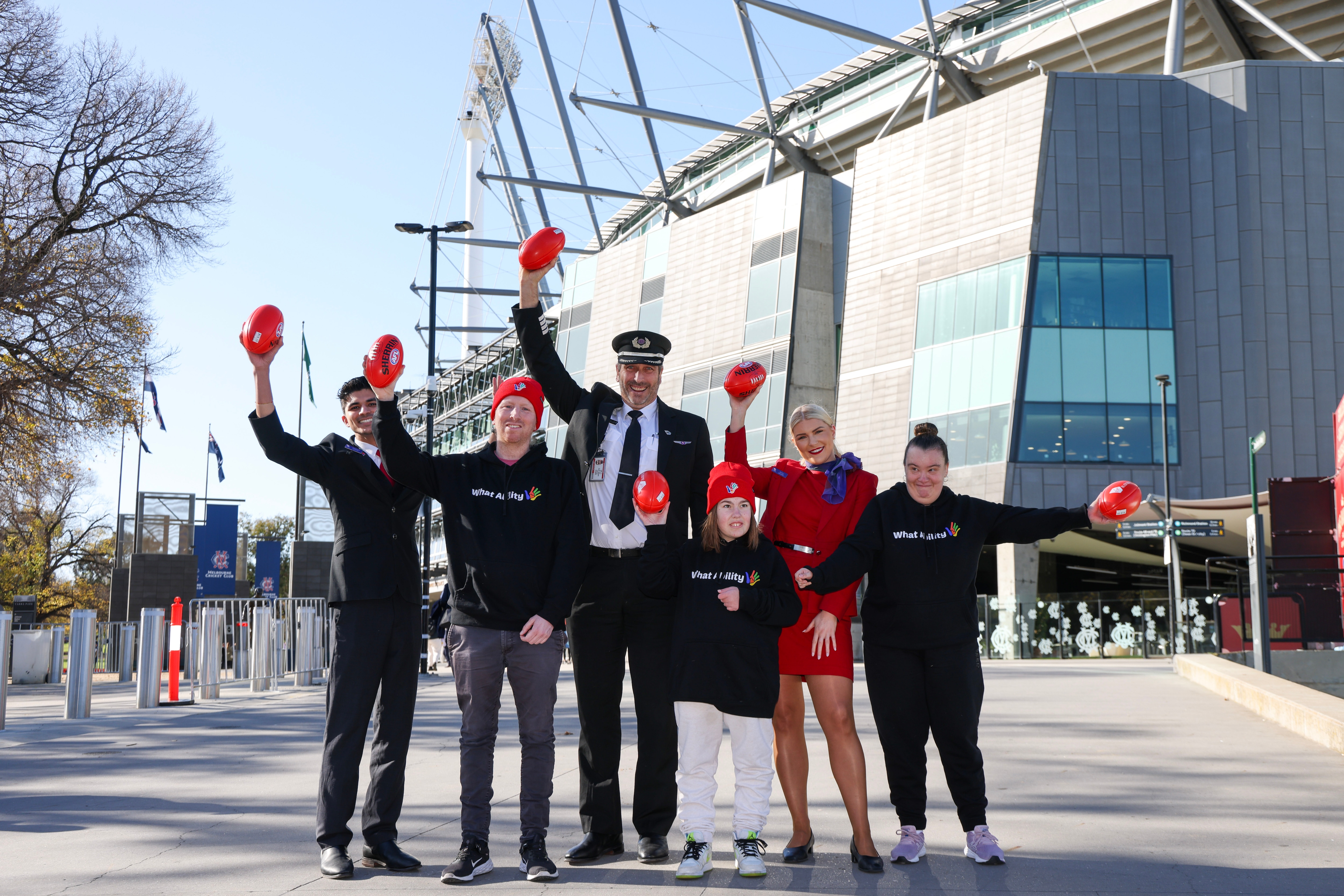 Virgin Australia team supporting What Ability out the front of sporting event