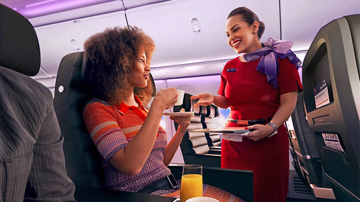 Virgin Australia cabin crew serving guests.