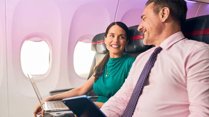 Business people on Virgin Australia flight.