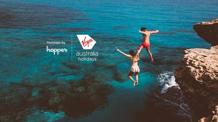 People diving into the ocean.