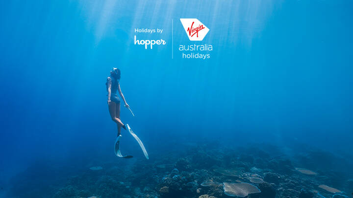 Woman diving in ocean.