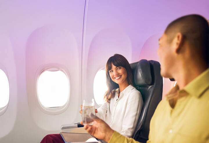 Virgin Australia passengers enjoying Business Class.