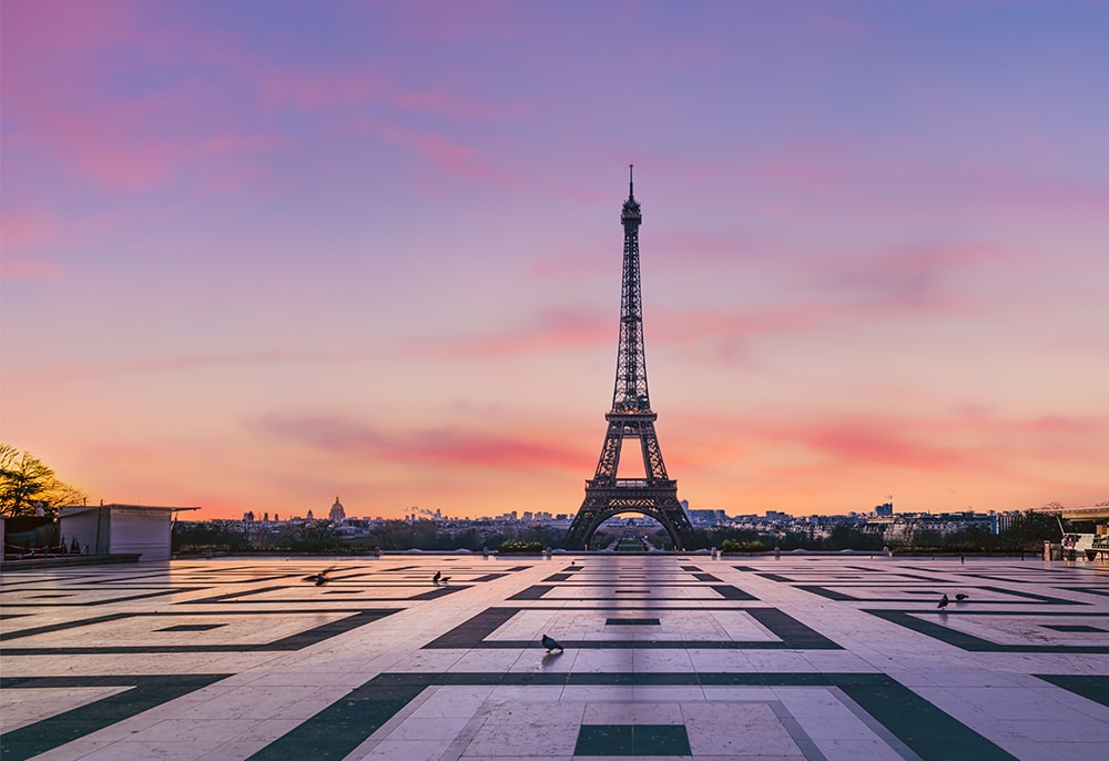 Eiffel tower in Paris, France at sunset.