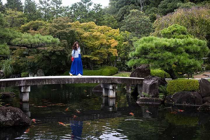 Woman on footbridge in Adelaide Himeji Gardens 
