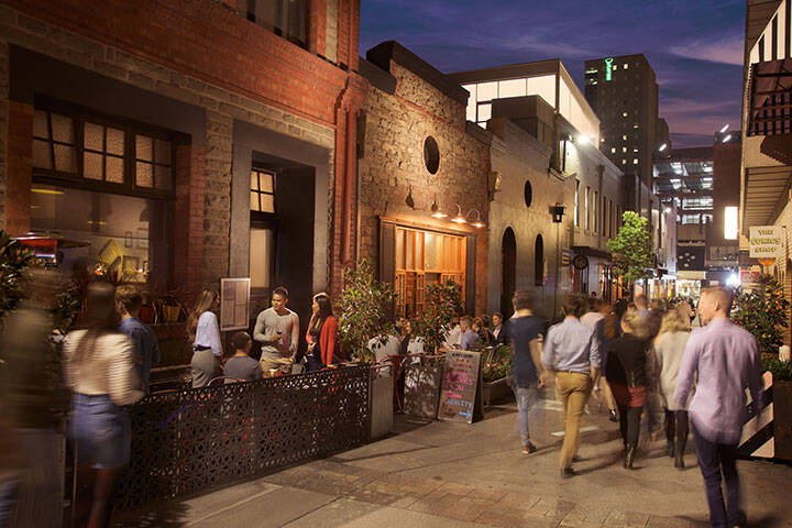 People enjoying food and drinks at the restaurants on Peel Street in West End 