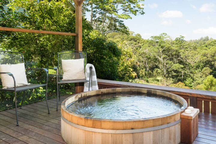 Spa bath on a deck at Spicers Tamarind Retreat