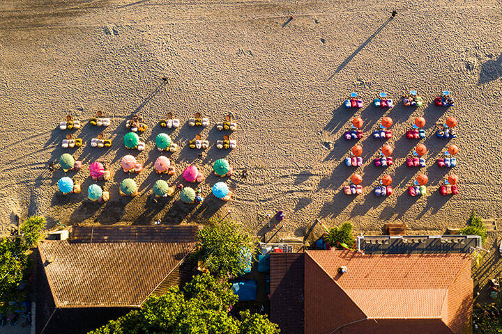 Overhead view of the famous beach bar on the Seminyak beach in Kuta, southern Bali in Indonesia