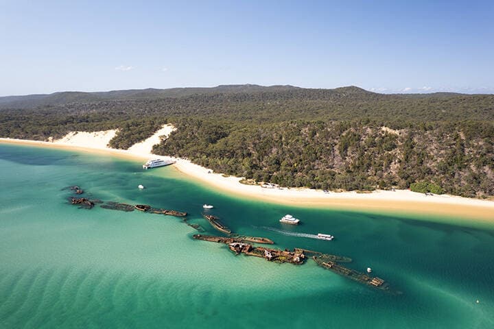 An aerial image of the shipwrecks and the shoreline at Moreton Island 
