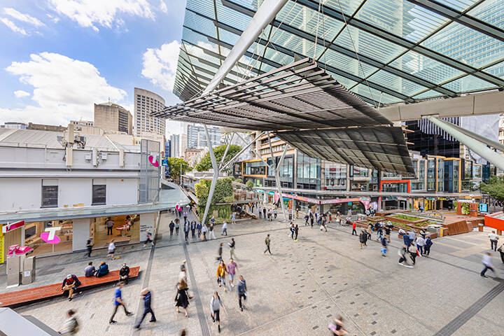 Pedestrians walking through Queen St Mall in Brisbane