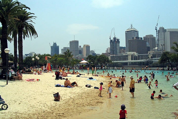 Crowds cooling off at Streets Beach, a man-made beach in South Bank in Brisbane CBD