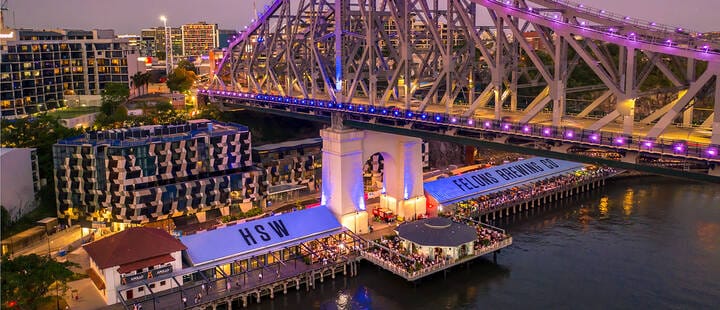 Aerial view of Howard Smith Wharves at night, the Story Bridge illuminated