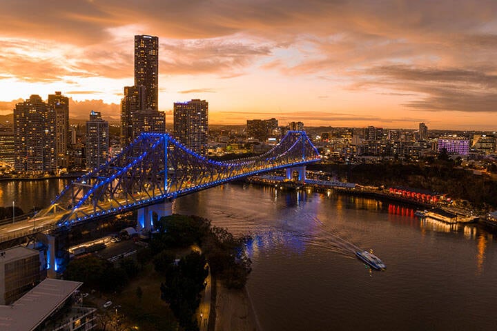 Aerial of Story Bridge and city buildings in the evening 