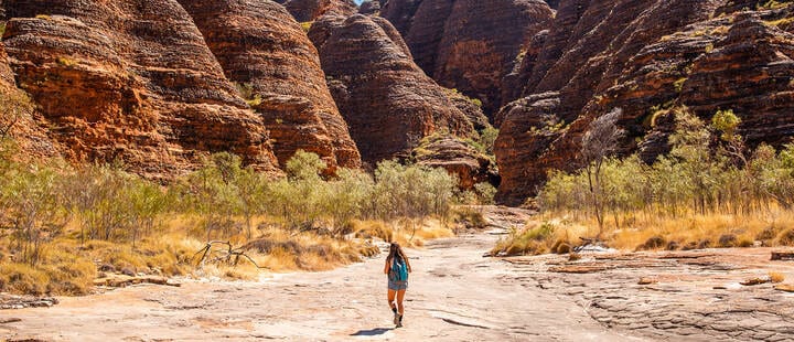 Lady hiking through the Bungle Bungle Range, Purnululu National Park