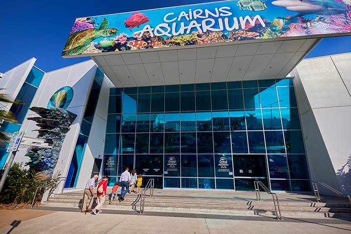 People walking in to the entrance of Cairns Aquarium