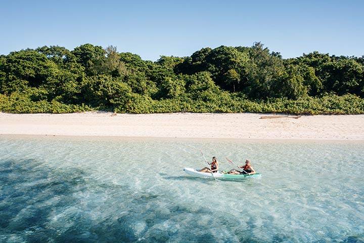 Couple kayaking off Green Island