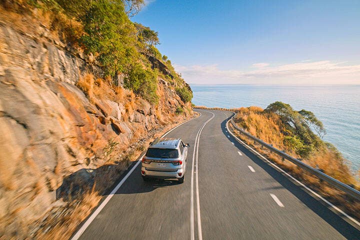 Car driving along the lookout on Captain Cook Highway between Cairns and Port Douglas