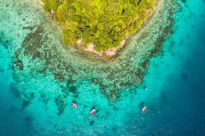 Snorkelling along a coral reef in Fiji's remote Lau Islands  