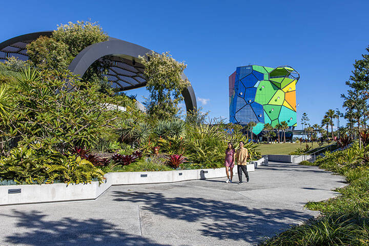 Couple walking along a path outside at HOTA