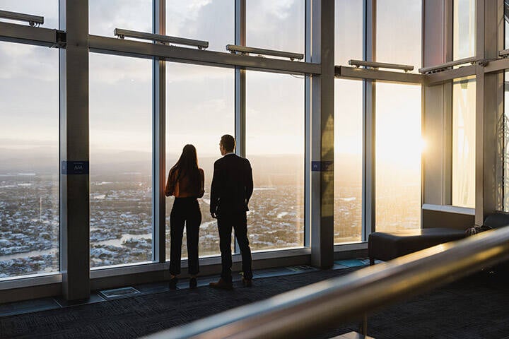 Visitors taking in the view at sunset at Skypoint Observation Deck