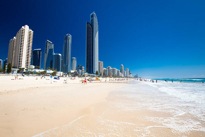 Skyline and white sand at Surfers Paradise Beach in Gold Coast