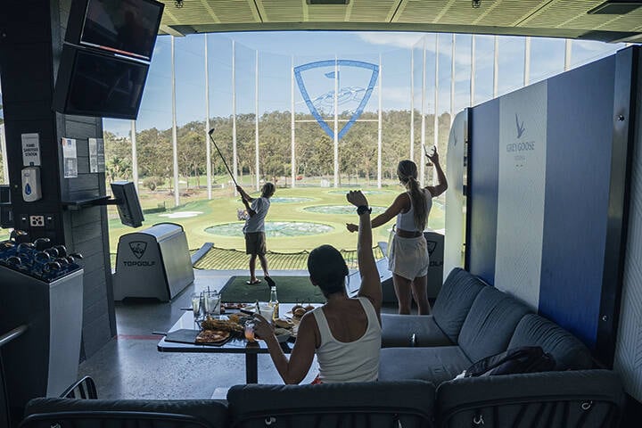 Family playing golf at Topgolf Gold Coast