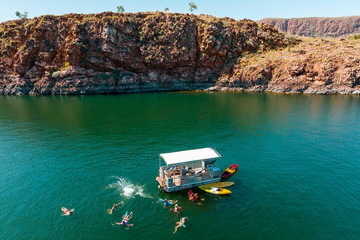 Aerial View of tourists enjoying a refreshing swim while on a Lake Argyle Cruise, near Kununurra 