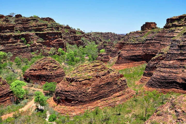 Just an hour’s drive north-west of Kununurra lies Wyndham, a historic town that boasts the best panoramic views in the Kimberley and is Western Australia’s northernmost town. Known as the oldest town in the region, Wyndham offers a fascinating blend of history and natural beauty.      A day tour to Wyndham includes a visit to the Five Rivers Lookout, where the panoramic view of five rivers converging into the Cambridge Gulf is a sight you won’t see anywhere else on earth. The town’s rich history is also on display at the Wyndham Museum, and for nature lovers, the nearby Parry Lagoons Nature Reserve offers fantastic birdwatching opportunities.      Travel tip: Bring binoculars—birdwatching at Parry Lagoons is some of the best in the region.      8. Hidden Valley tour: Discover Kununurra’s mini Bungle Bungles 