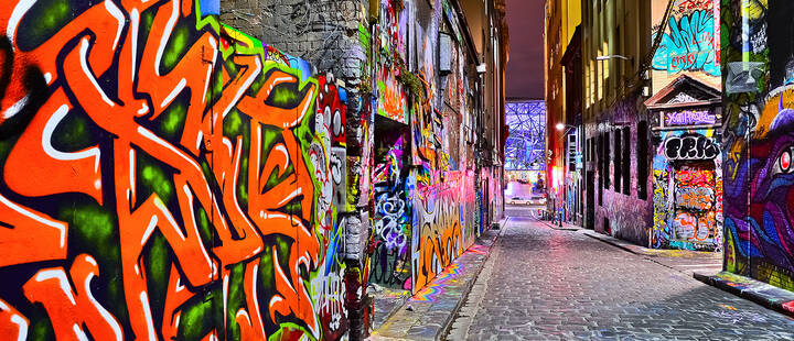 Colourful graffiti and artwork at Hosier Lane in Melbourne at night