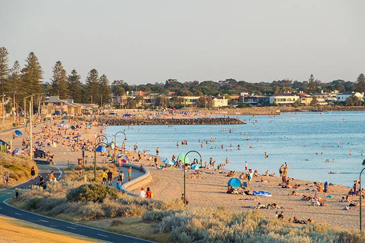 People on Elwood Beach in the inner Melbourne suburb of Elwood on a hot, sunny day. 
