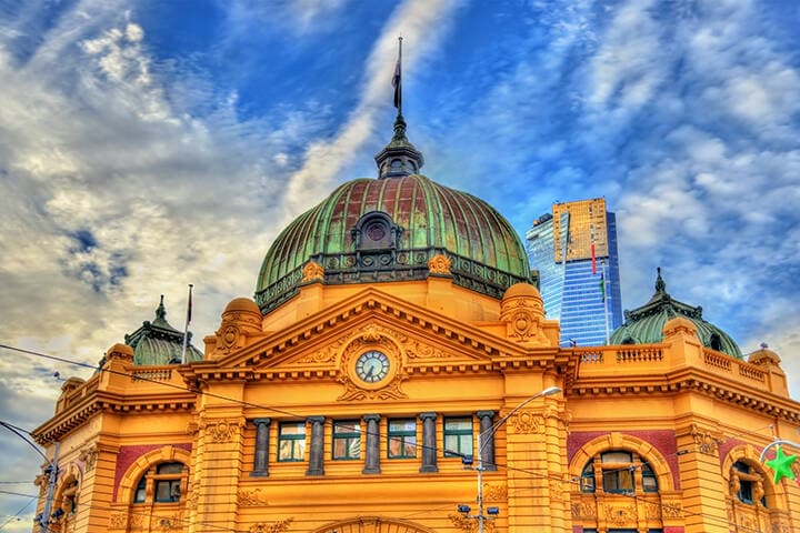 Flinders Street railway station, an iconic building of Melbourne, on a partially cloudy day