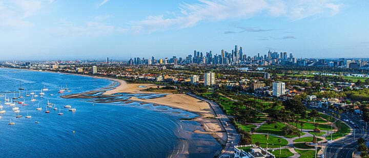 Aerial shot of the Melbourne city coastline and city on a partly cloudy day