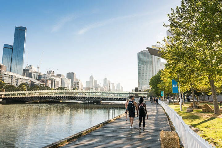 Walking along the banks of the Yarra River through Melbourne. 