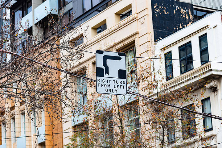 The famous Melbourne city hook turn, where cars turn right from the left hand lane.