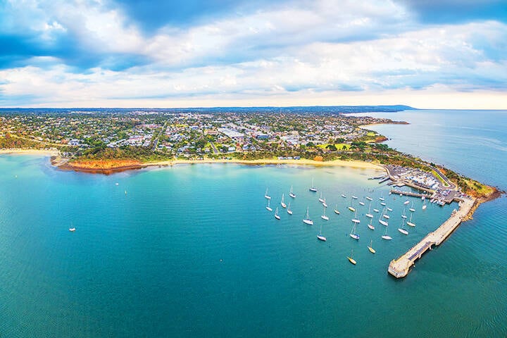 Beautiful aerial panorama of Mornington Peninsula coastline and Mornington Pier at sunset. Melbourne, Victoria, Australia
