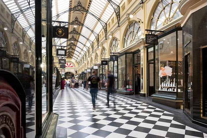 Royal Arcade, the oldest shopping arcade in Melbourne CBD with high glass roof and Southern end featuring Gog and Magog statues, and Gaunt's clock.