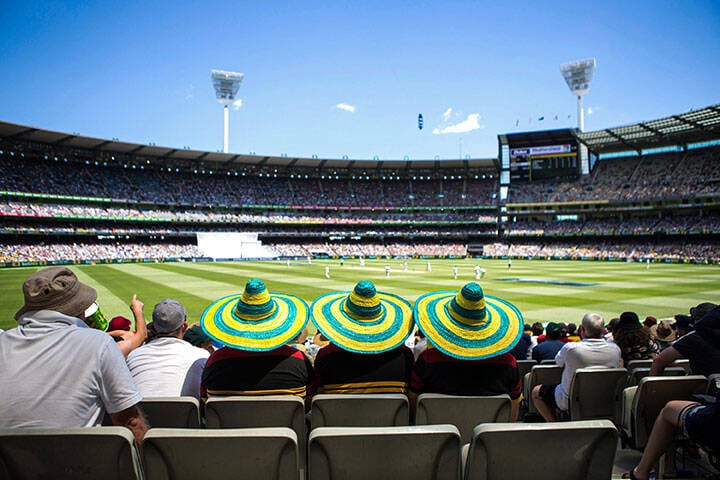Watching a match at Melbourne Cricket Ground 