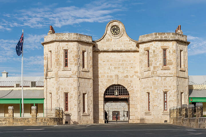 The historic Fremantle Prison and the Australian flag on a beautiful sunny day, Western Australia