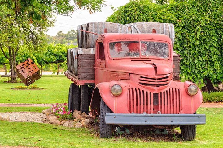 Old red wine barrel truck on display at Swanbrook Winery & Cafe in the Swan Valley - Perth, WA, Australia 
