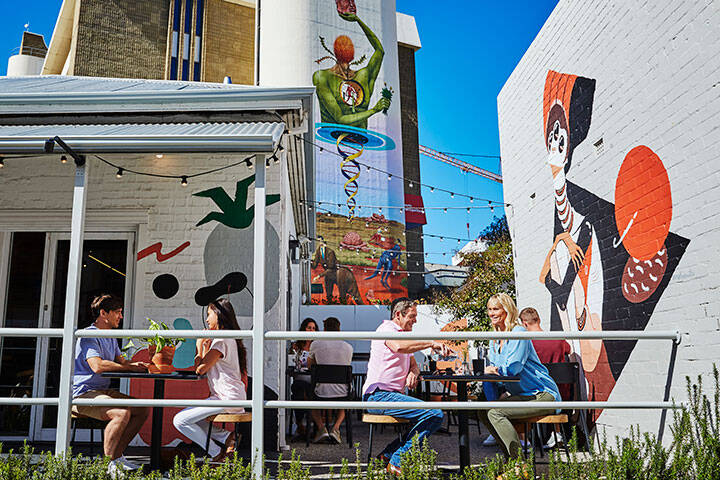 Casual dining, Northbridge cafe with local Urban art in the background.