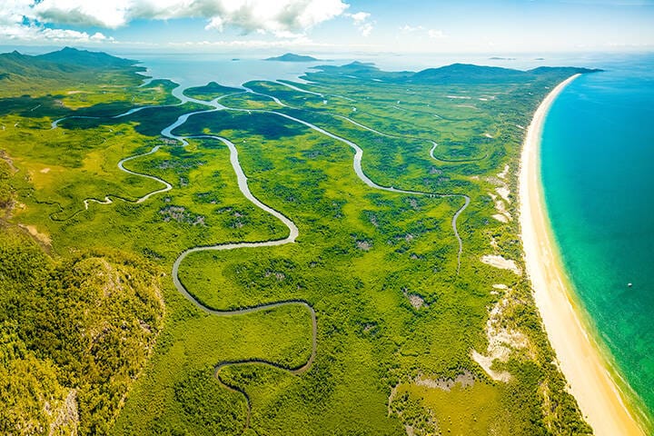 Mountains, rivers and Ramsay Bay Beach along the Thorsborne Trail on Hinchinbrook Island