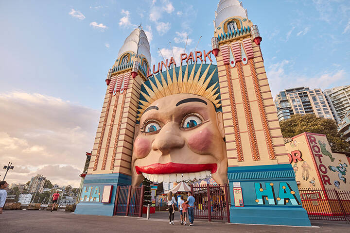 Family walking into Luna Park Sydney, Milsons Point  