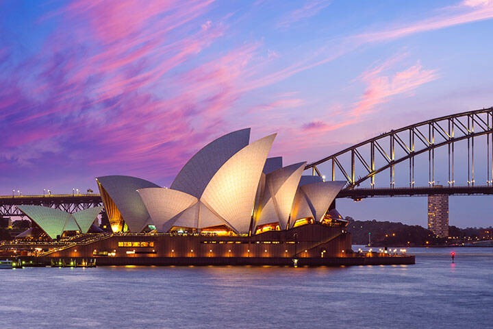 A pink sunset at the Sydney Opera House, a multi venue performing arts centre at Sydney Harbour located in Sydney, New South Wales, Australia. It became a UNESCO World Heritage Site on 28 June 2007.