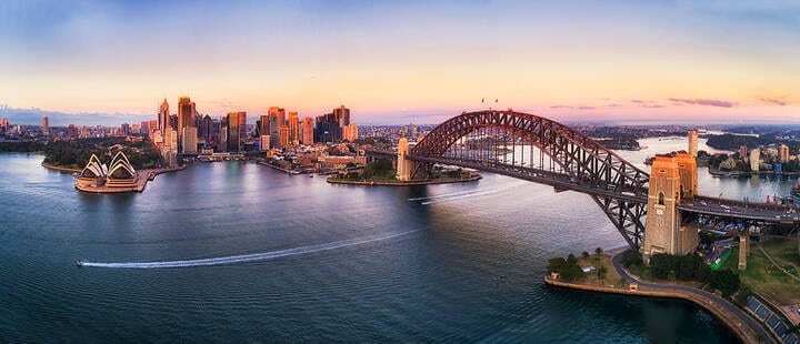 Aerial view of Sydney CBD, Sydney Harbour Bridge and Opera House at sunrise