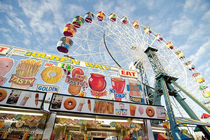 Food store canteen near the colorful Ferris wheel at Sydney Royal Easter show. 