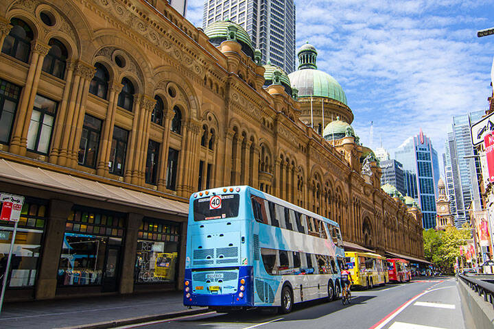 Sydney buses at the bus stop on York St. at Queen Victoria Building.