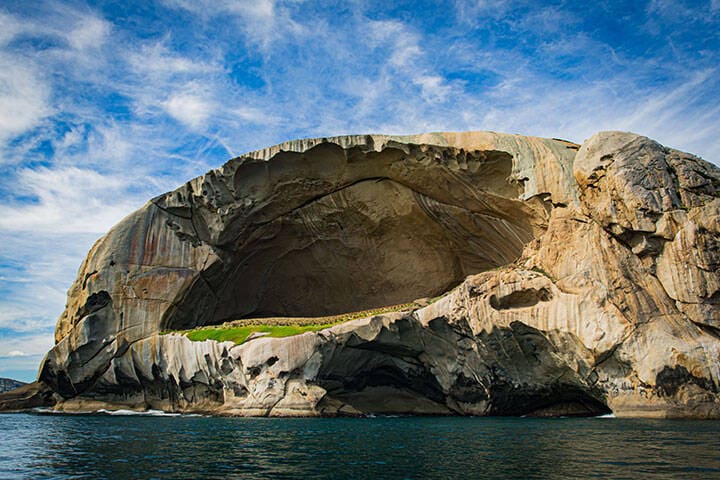 Skull Rock stone island seascape in Cruising tour view in the Bass Strait at Wilson Promontory Victoria Australia