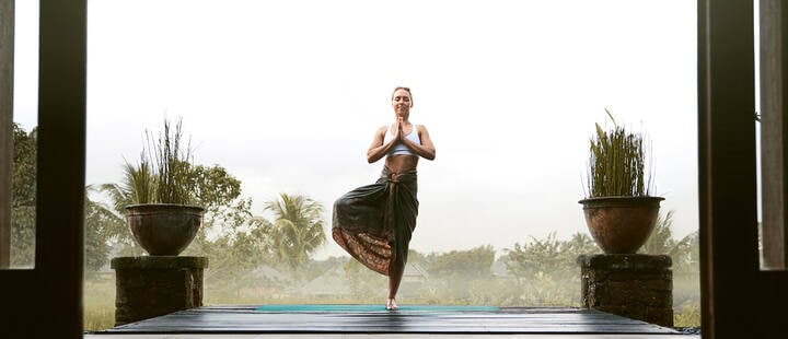 Woman doing a yoga pose in Ubud, Bali
