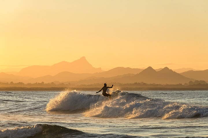 Surfing at sunset in Byron Bay