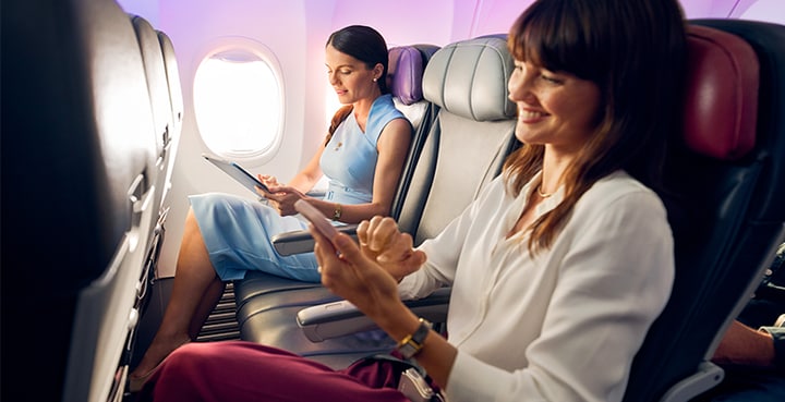 Passengers travelling in Economy cabin on Virgin Australia flight enjoying extra room with Neighbour Free Seating